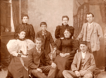 photo portrait of Jewett with six siblings and mother